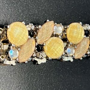 Costume yellow bracelet. Slides over wrist so the bracelet fits most people.